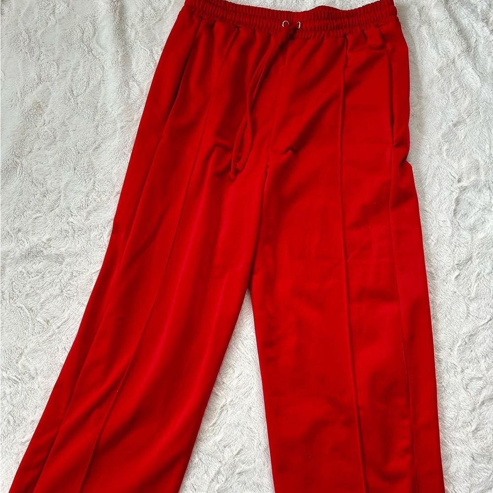 Red track pants